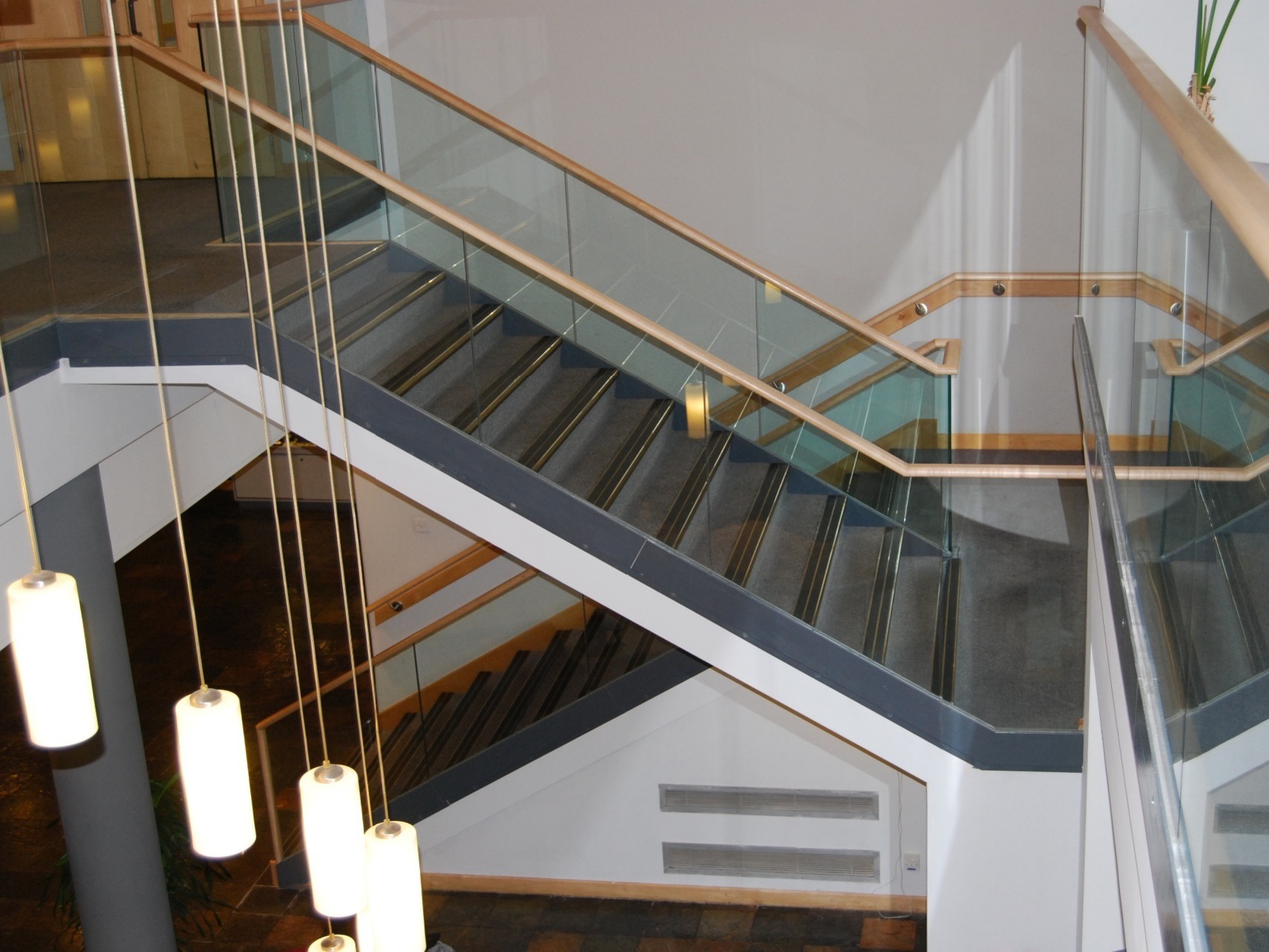 Frameless Glass Stair Balustrade with a Timber Handrail